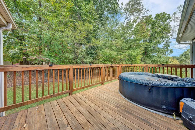 a balcony with wooden floor