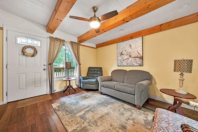 a living room with furniture and a window
