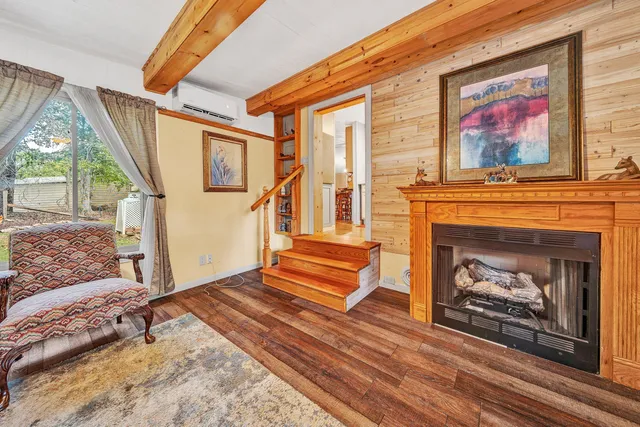 a bedroom with a bed and a fireplace