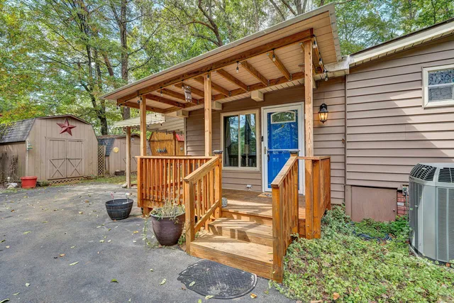 a view of a chair and table in the patio
