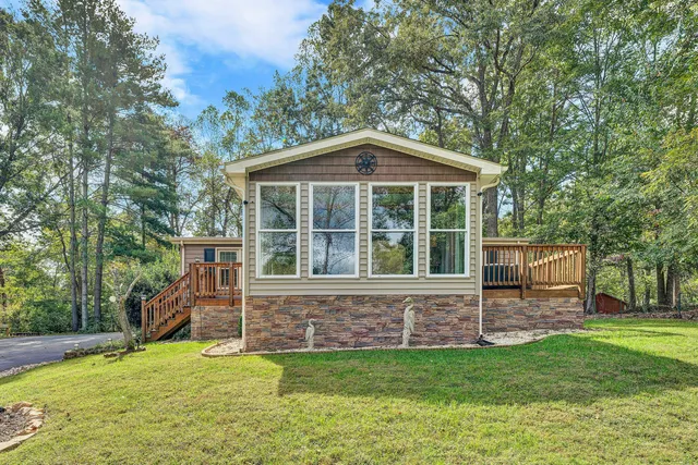 a view of a house with a backyard
