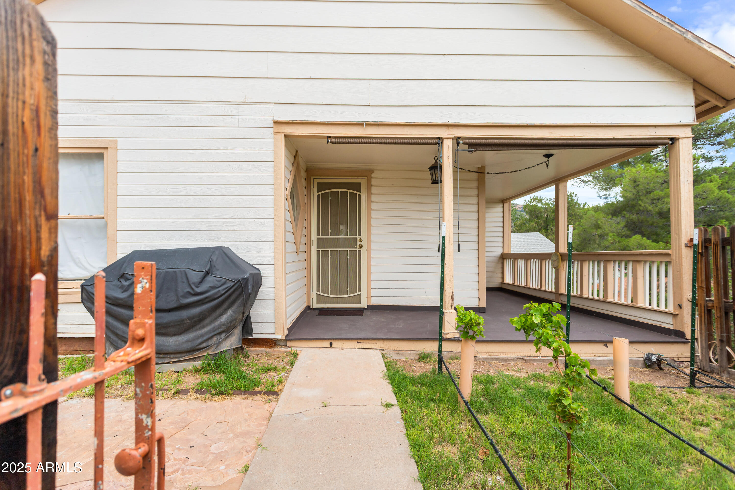 428 Brophy Avenue, Unit D Bisbee, AZ 85603 - Photo 12 of 40 a front view of a house with a garden