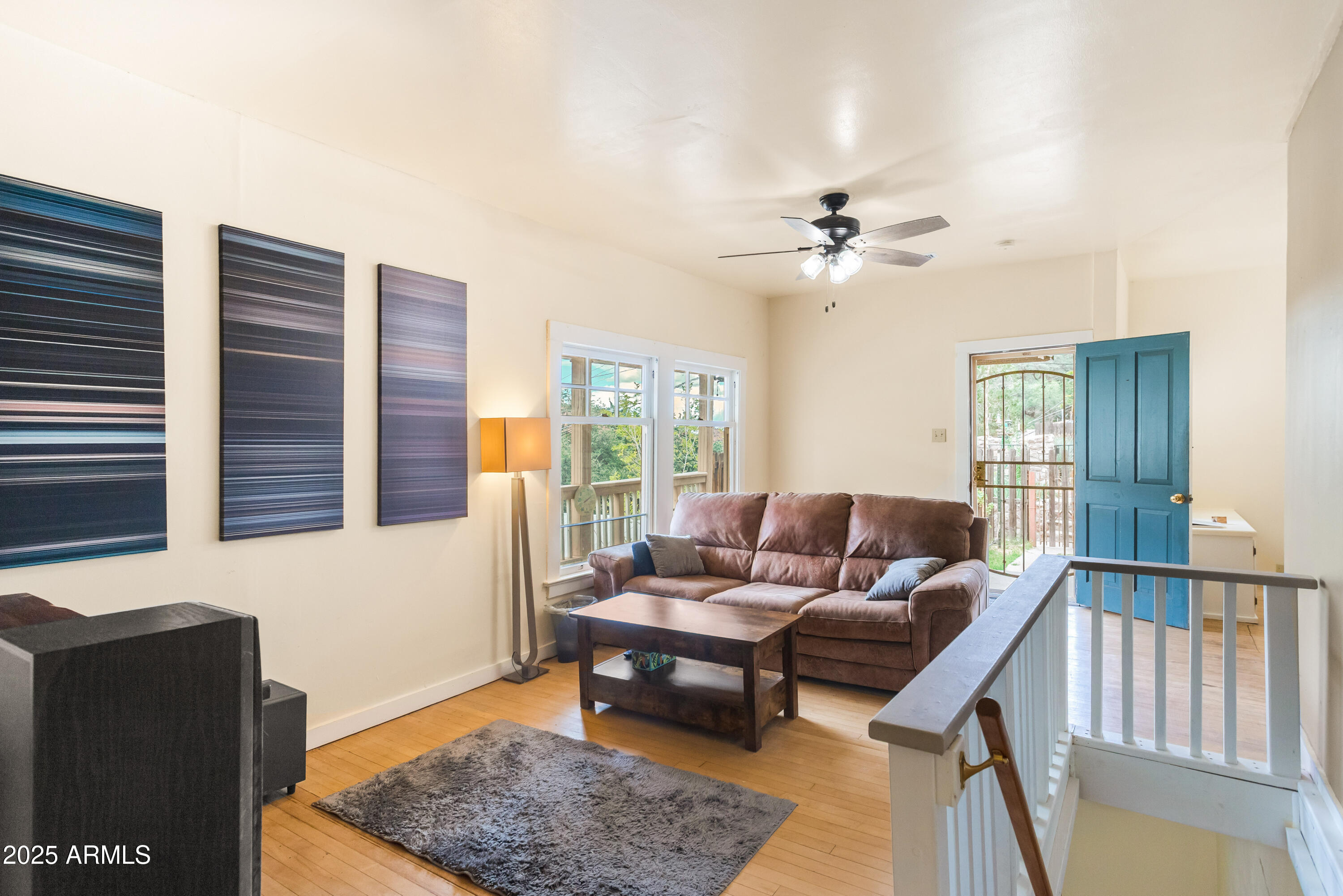 428 Brophy Avenue, Unit D Bisbee, AZ 85603 - Photo 19 of 40 a living room with furniture ceiling fan and a rug