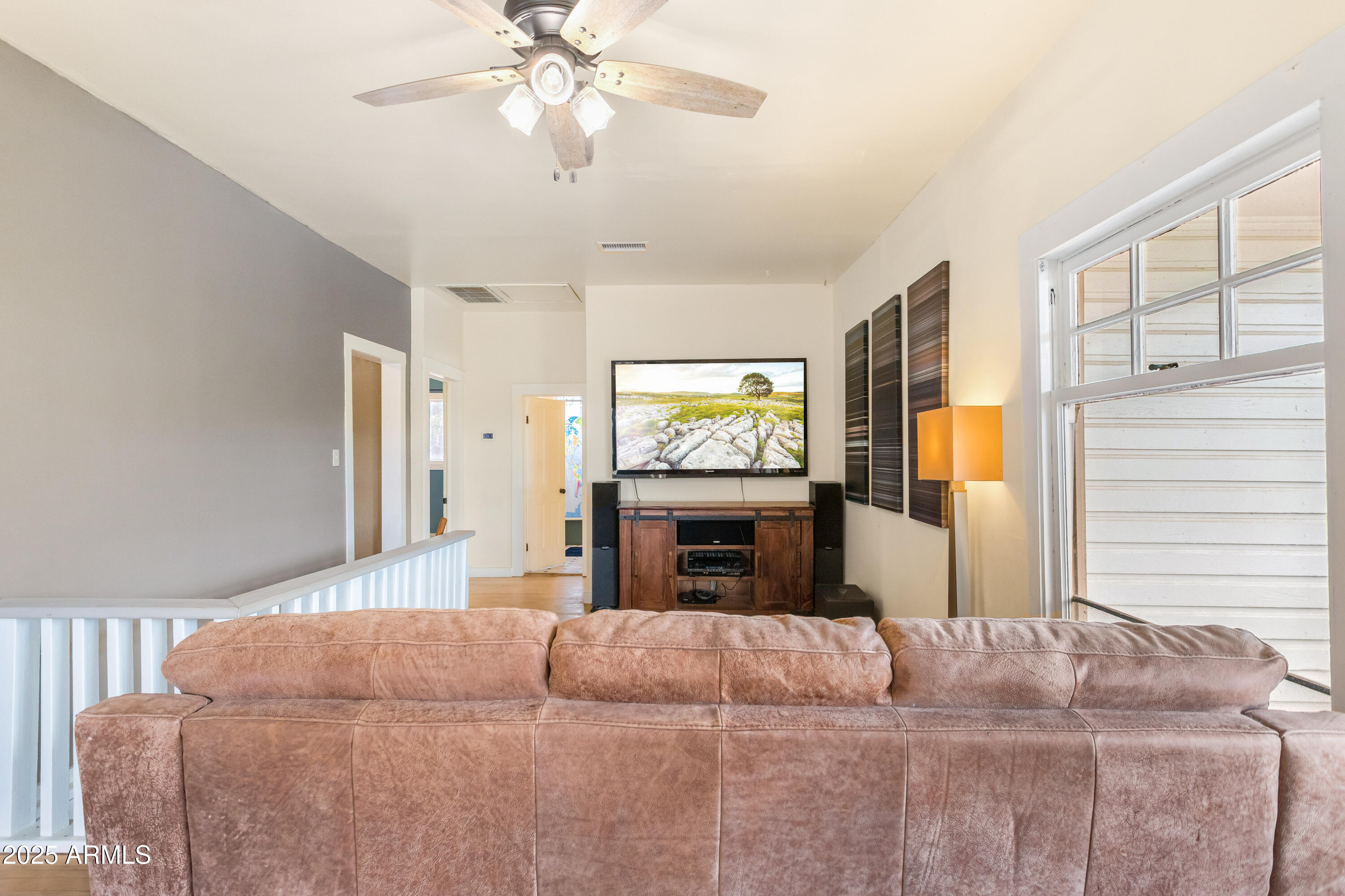 428 Brophy Avenue, Unit D Bisbee, AZ 85603 - Photo 20 of 40 a bedroom with a large bed and a tv