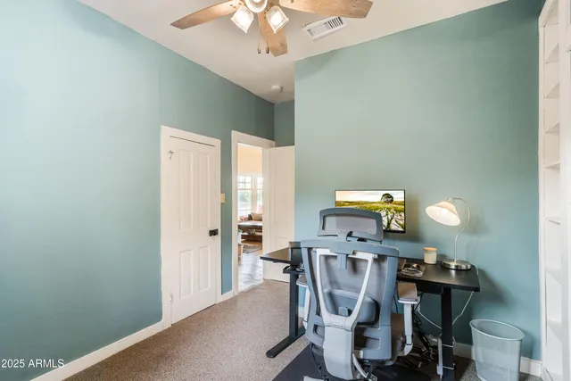 a dining room with furniture and chandelier