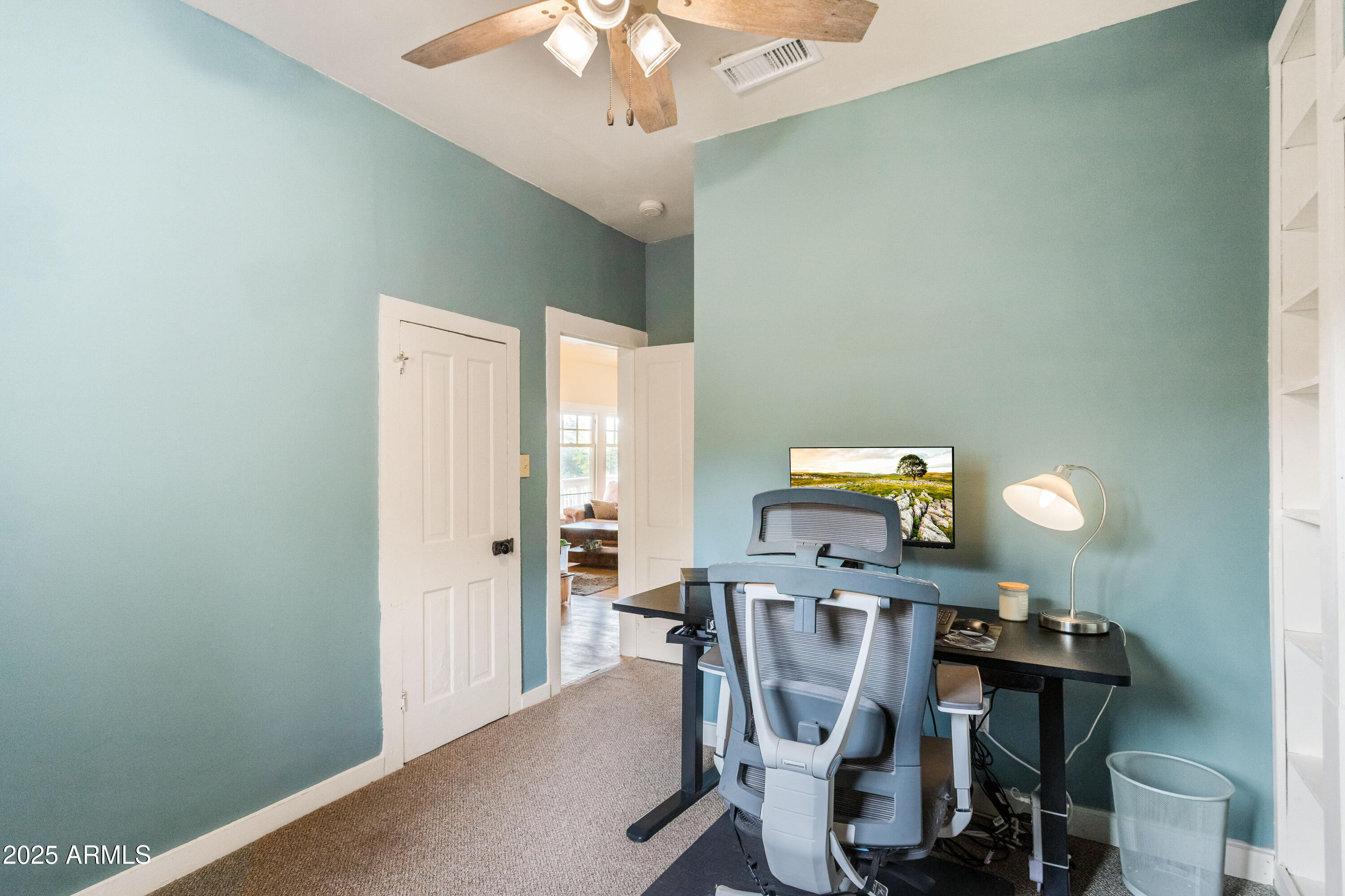 428 Brophy Avenue, Unit D Bisbee, AZ 85603 - Photo 21 of 40 a dining room with furniture and chandelier