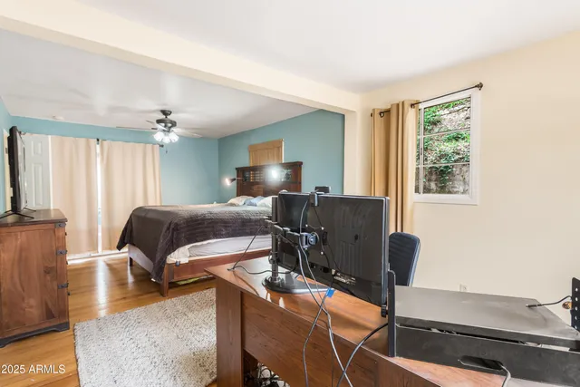 a bedroom with furniture and a window