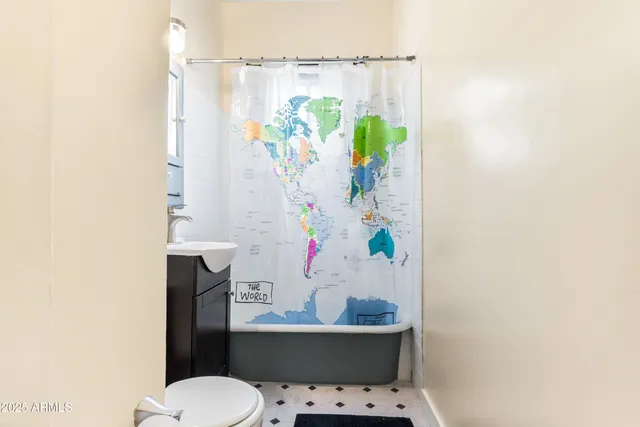a view of a livingroom with wooden floor and a staircase