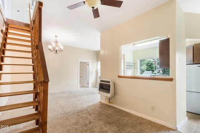 a view of a livingroom with an empty space and a fireplace