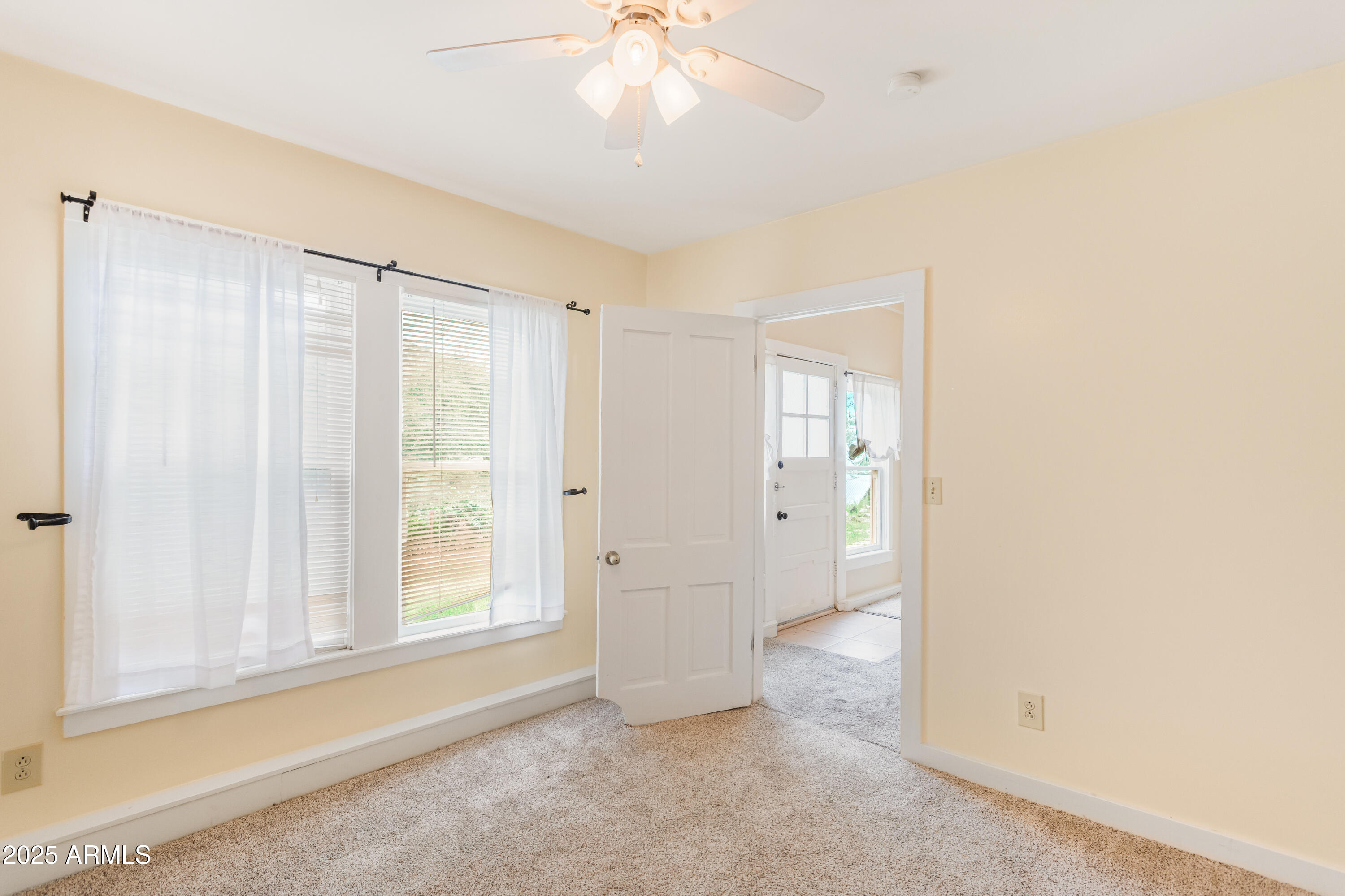 428 Brophy Avenue, Unit D Bisbee, AZ 85603 - Photo 35 of 40 wooden floor in an empty room with a window
