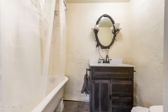 a view of a patio with a table and chairs and ice snow