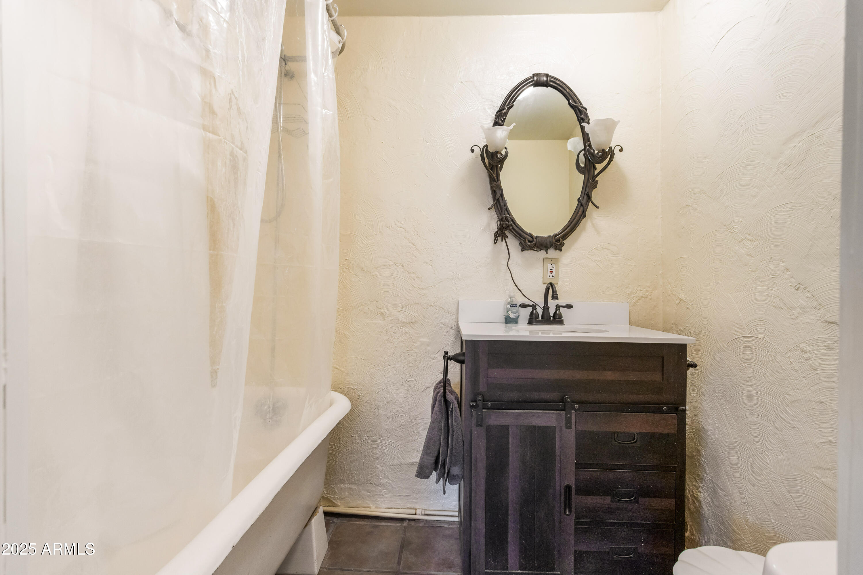 428 Brophy Avenue, Unit D Bisbee, AZ 85603 - Photo 37 of 40 a bathroom with a sink and a mirror