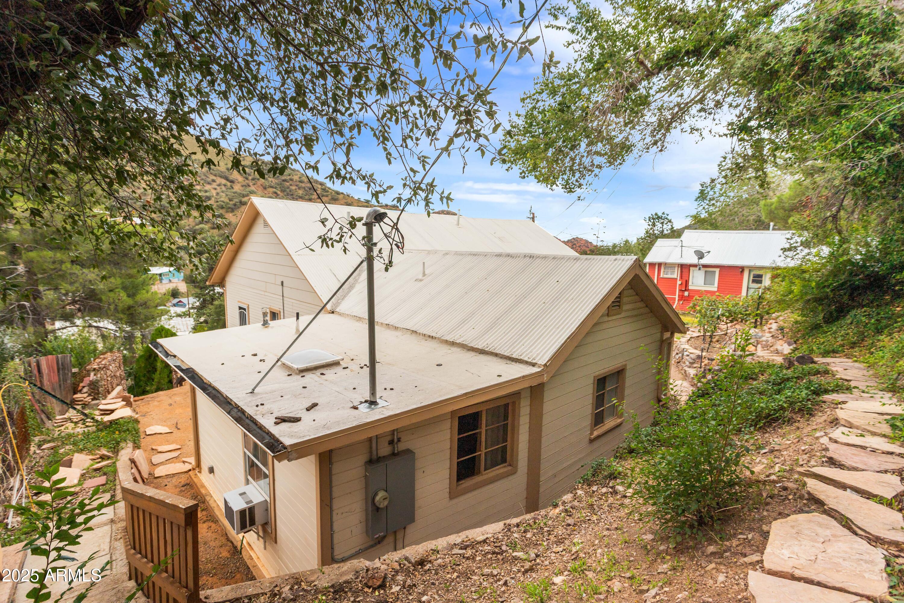 428 Brophy Avenue, Unit D Bisbee, AZ 85603 - Photo 8 of 40 a view of a house with a tree in the background