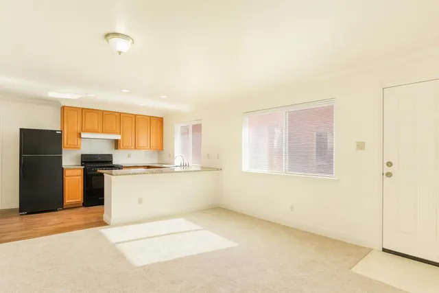 a view of an empty room with a window