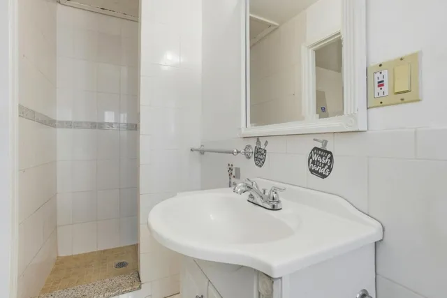 a white sink sitting next to a white sink