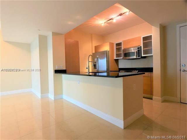 951 Brickell Avenue, Unit 2405 Miami, FL 33131 - Photo 12 of 38 a view of a kitchen with a sink
