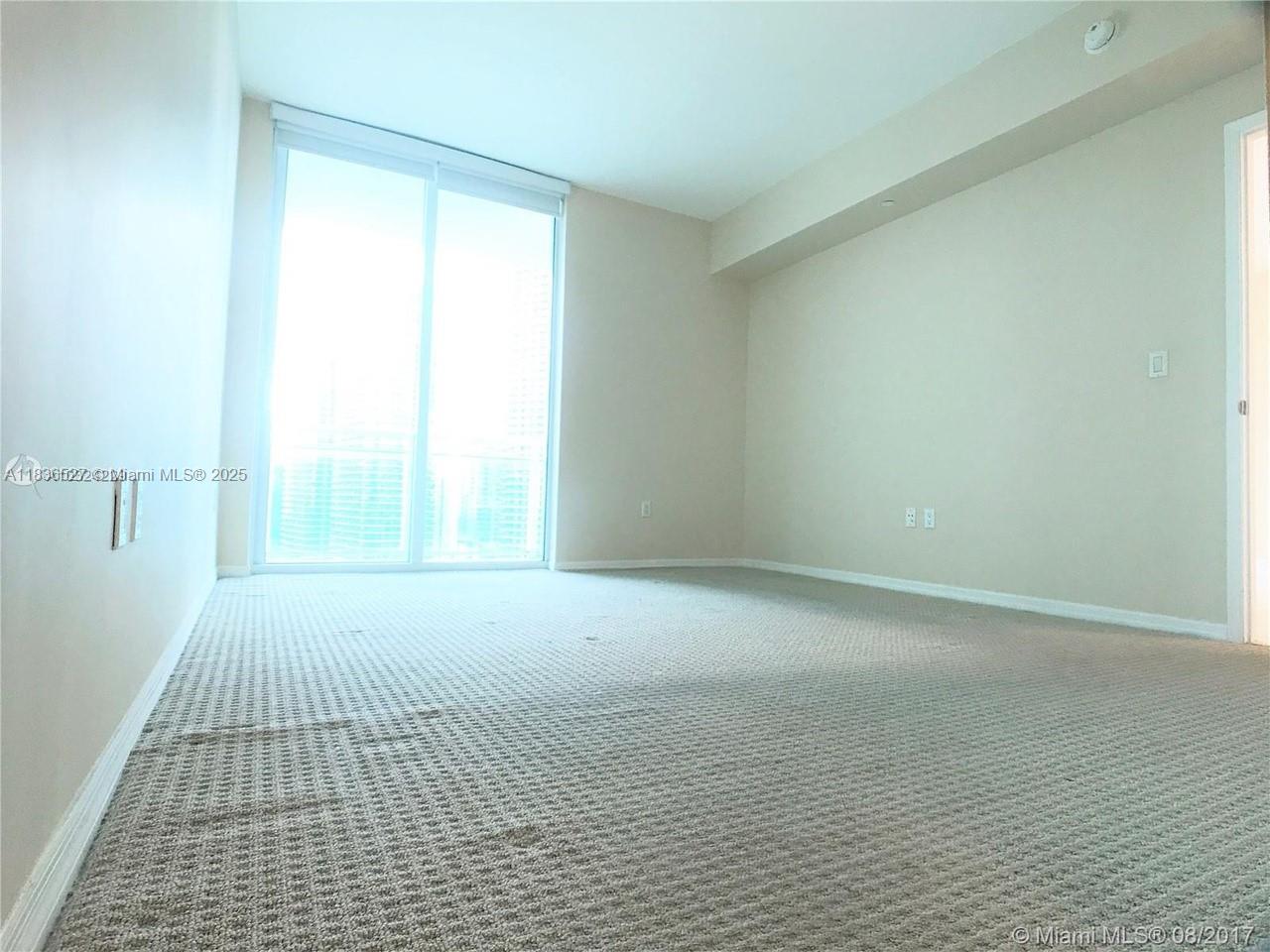 951 Brickell Avenue, Unit 2405 Miami, FL 33131 - Photo 20 of 38 a view of an empty room with a window