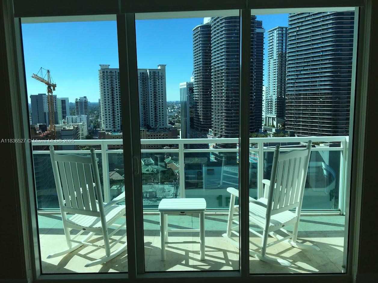 951 Brickell Avenue, Unit 2405 Miami, FL 33131 - Photo 2 of 38 a view of a balcony and window