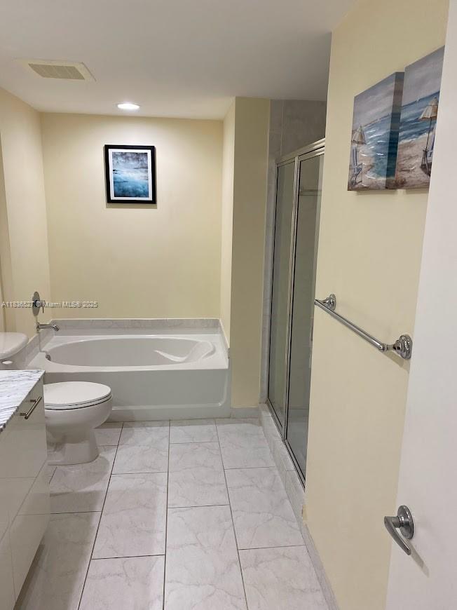 951 Brickell Avenue, Unit 2405 Miami, FL 33131 - Photo 22 of 38 a bathroom with a toilet and a shower