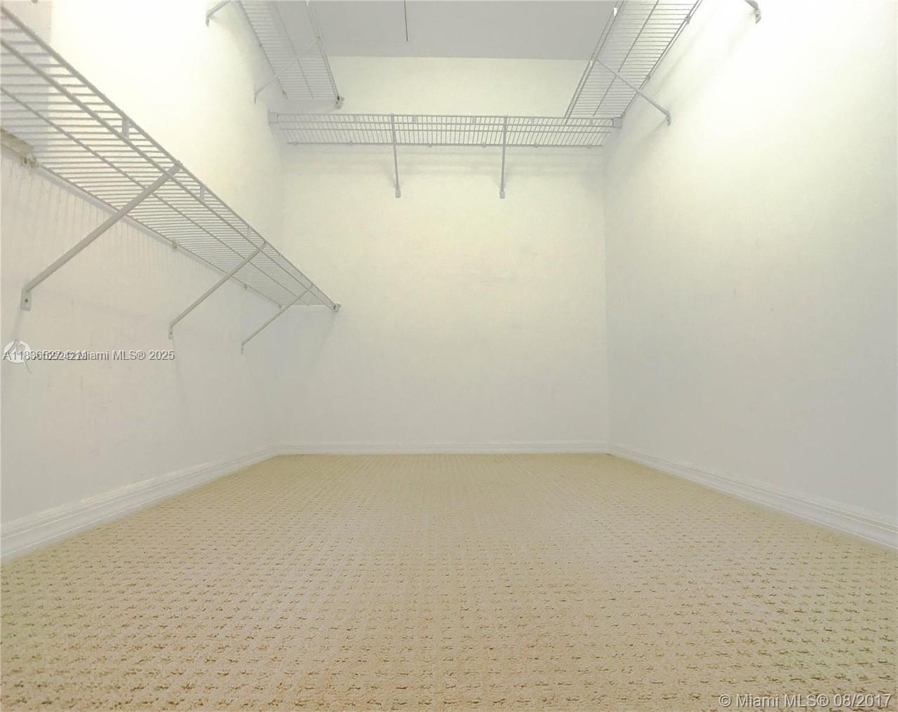 951 Brickell Avenue, Unit 2405 Miami, FL 33131 - Photo 23 of 38 a view of a room with racks on the wall