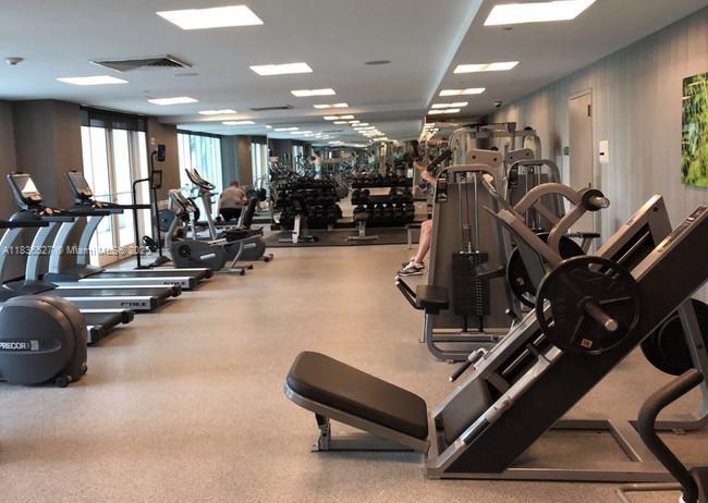 951 Brickell Avenue, Unit 2405 Miami, FL 33131 - Photo 30 of 38 a view of a room with gym equipment