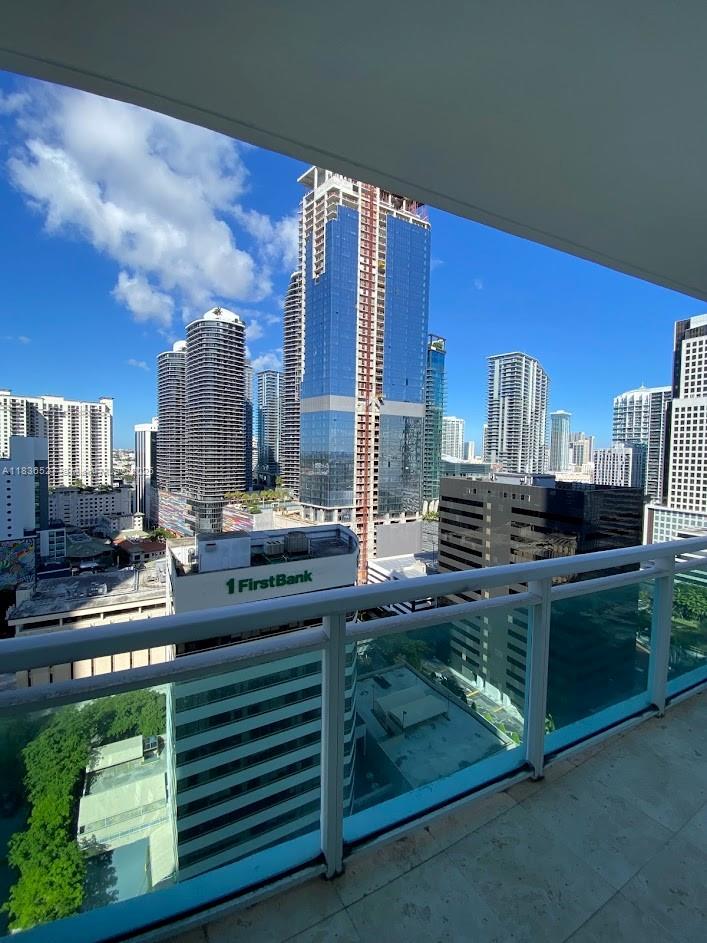 951 Brickell Avenue, Unit 2405 Miami, FL 33131 - Photo 35 of 38 a kitchen with a stove and a refrigerator