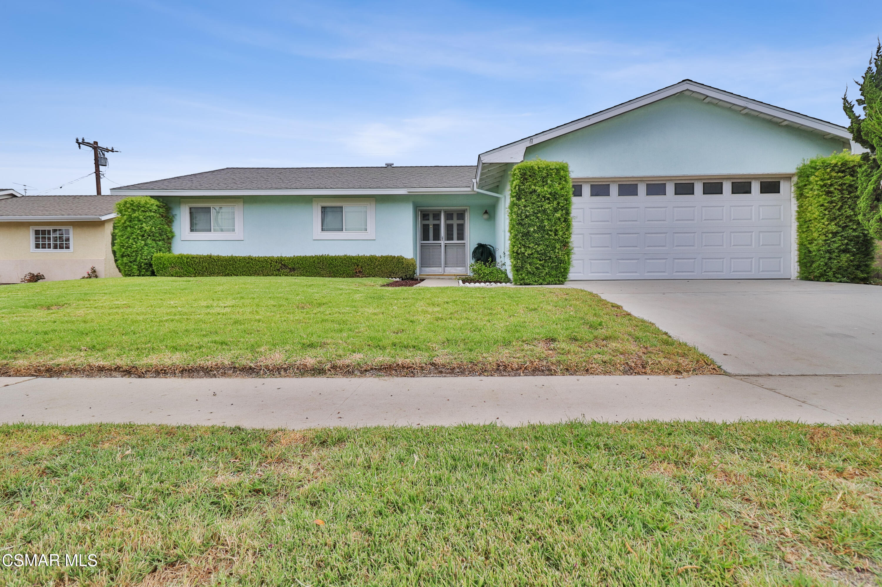 1567 Fitzgerald Road Simi Valley, CA 93065 - Photo 1 of 25 a front view of a house with a yard and garage