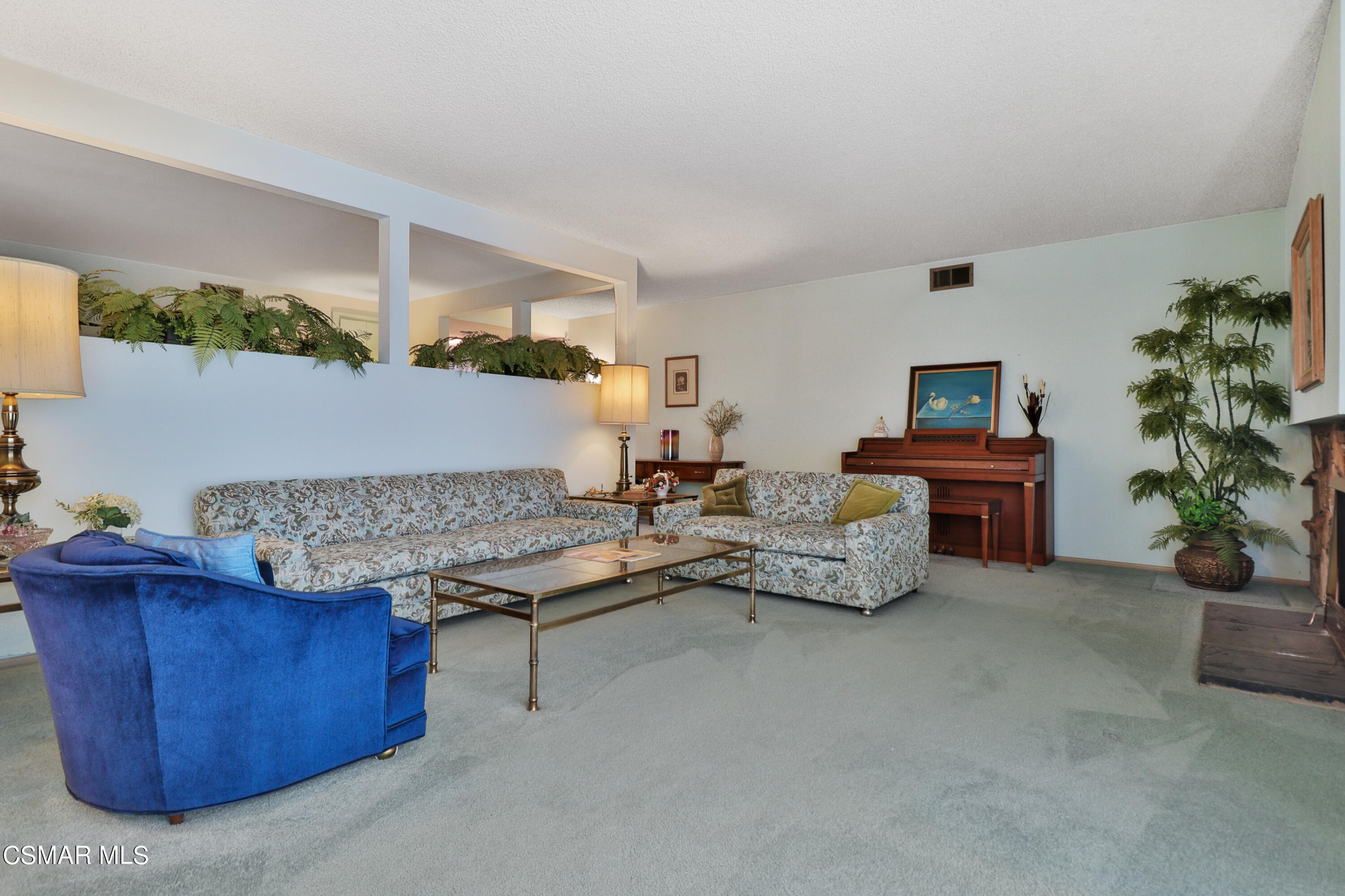 1567 Fitzgerald Road Simi Valley, CA 93065 - Photo 11 of 25 a living room with furniture and a potted plant