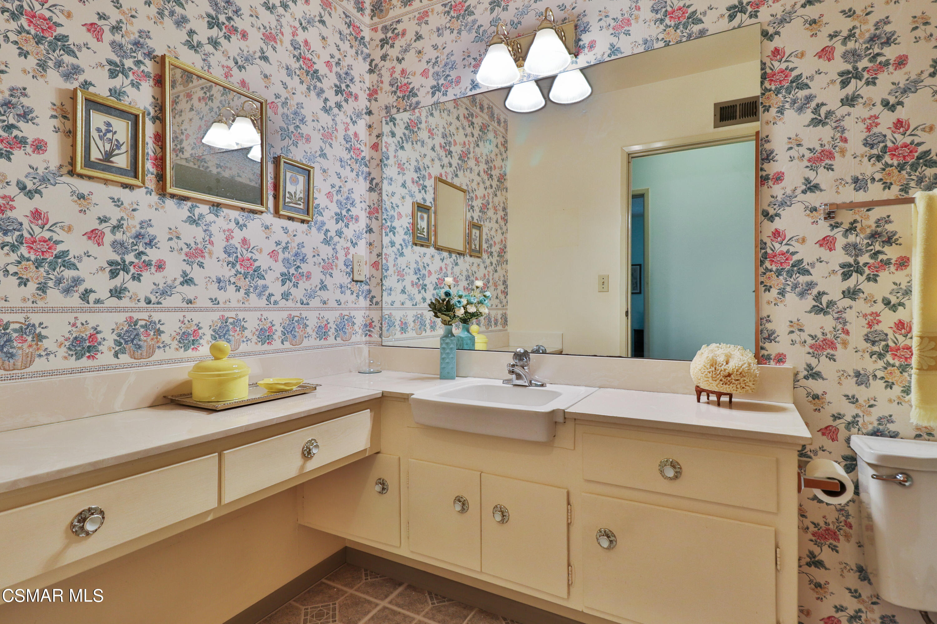 1567 Fitzgerald Road Simi Valley, CA 93065 - Photo 12 of 25 a bathroom with a sink a mirror and a shower