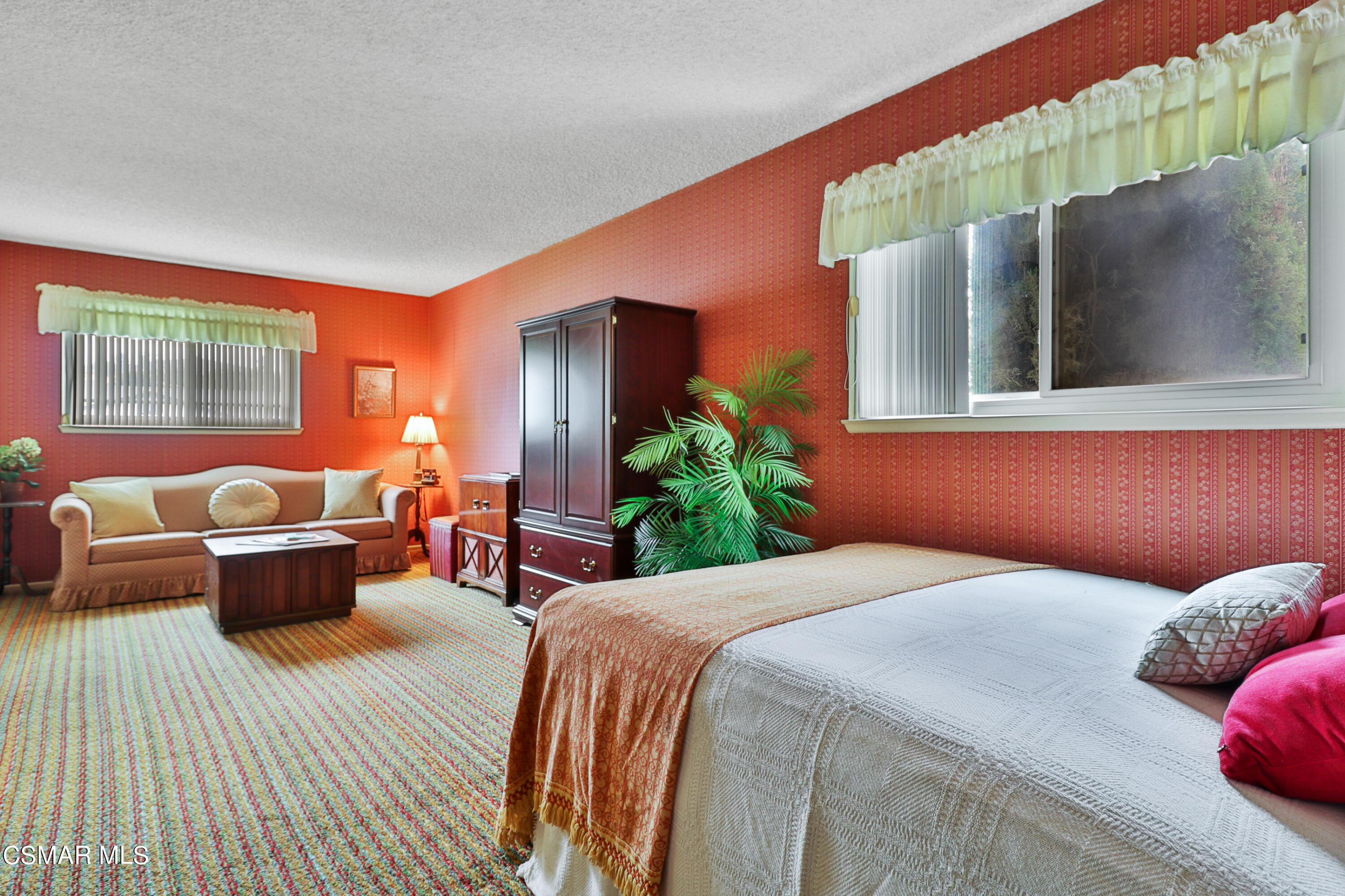 1567 Fitzgerald Road Simi Valley, CA 93065 - Photo 17 of 25 a bedroom with a large bed couch and a window