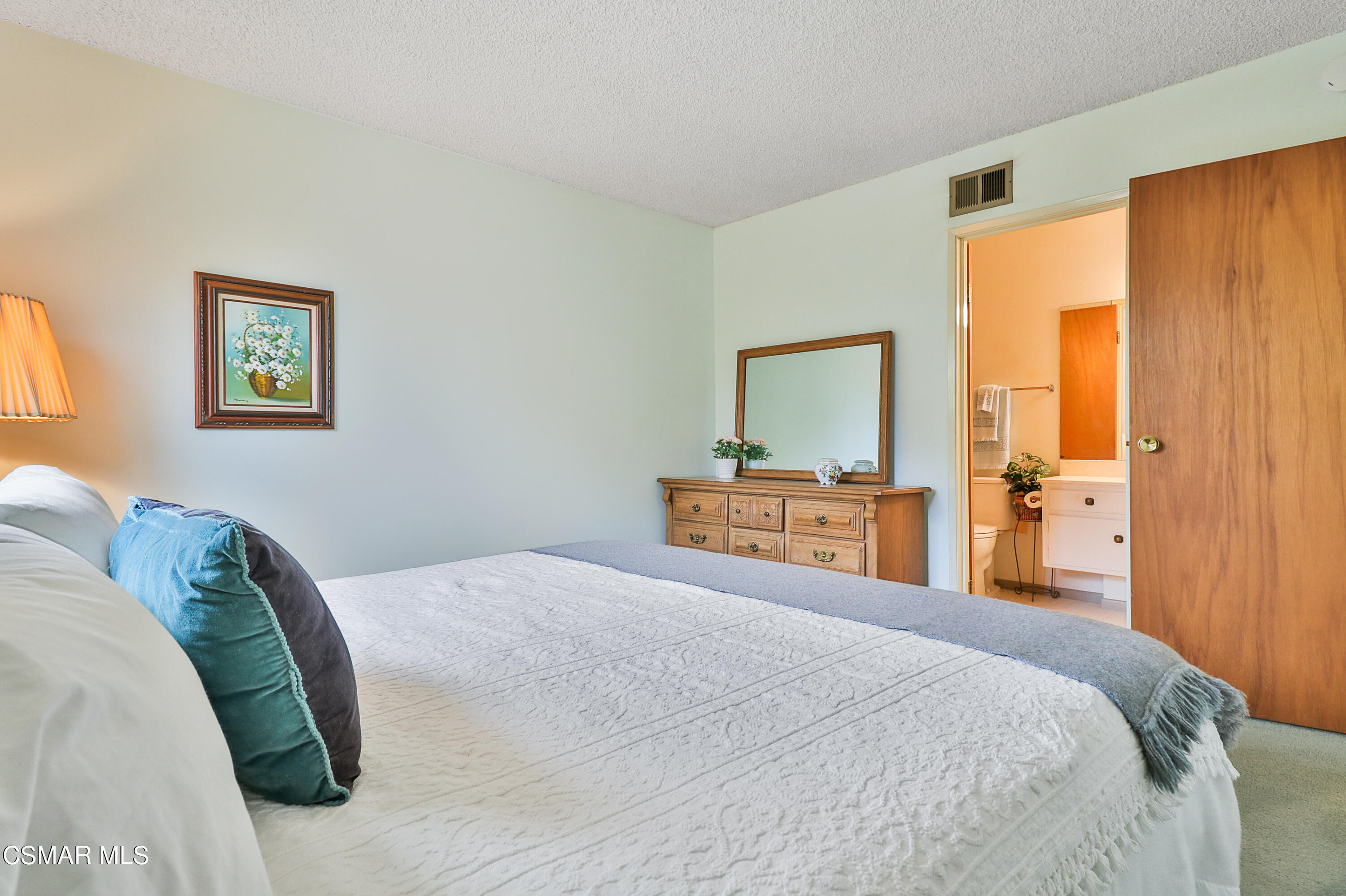1567 Fitzgerald Road Simi Valley, CA 93065 - Photo 19 of 25 a bedroom with a bed and a painting on the wall