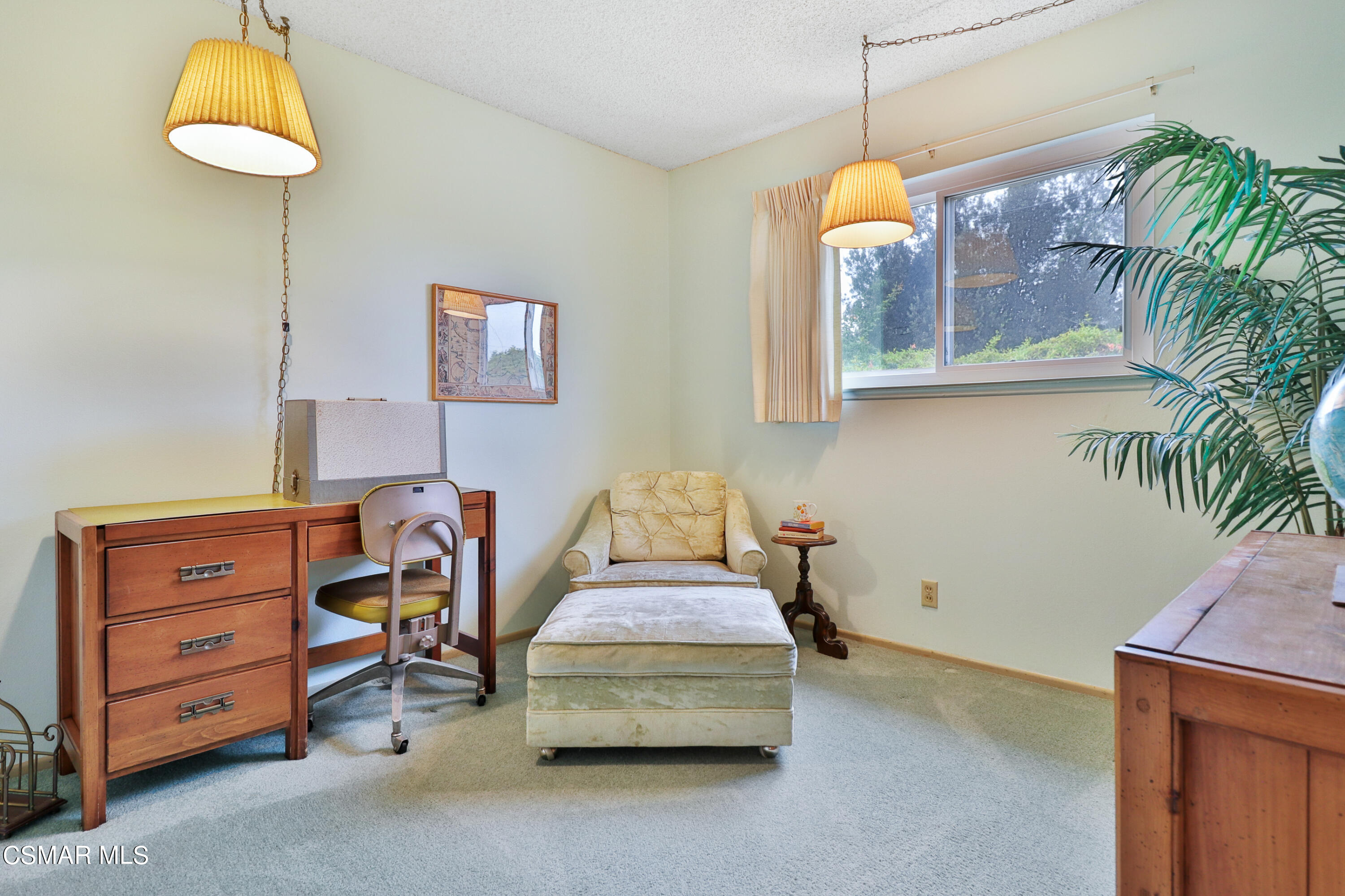 1567 Fitzgerald Road Simi Valley, CA 93065 - Photo 21 of 25 a bedroom with a bed and a chandelier