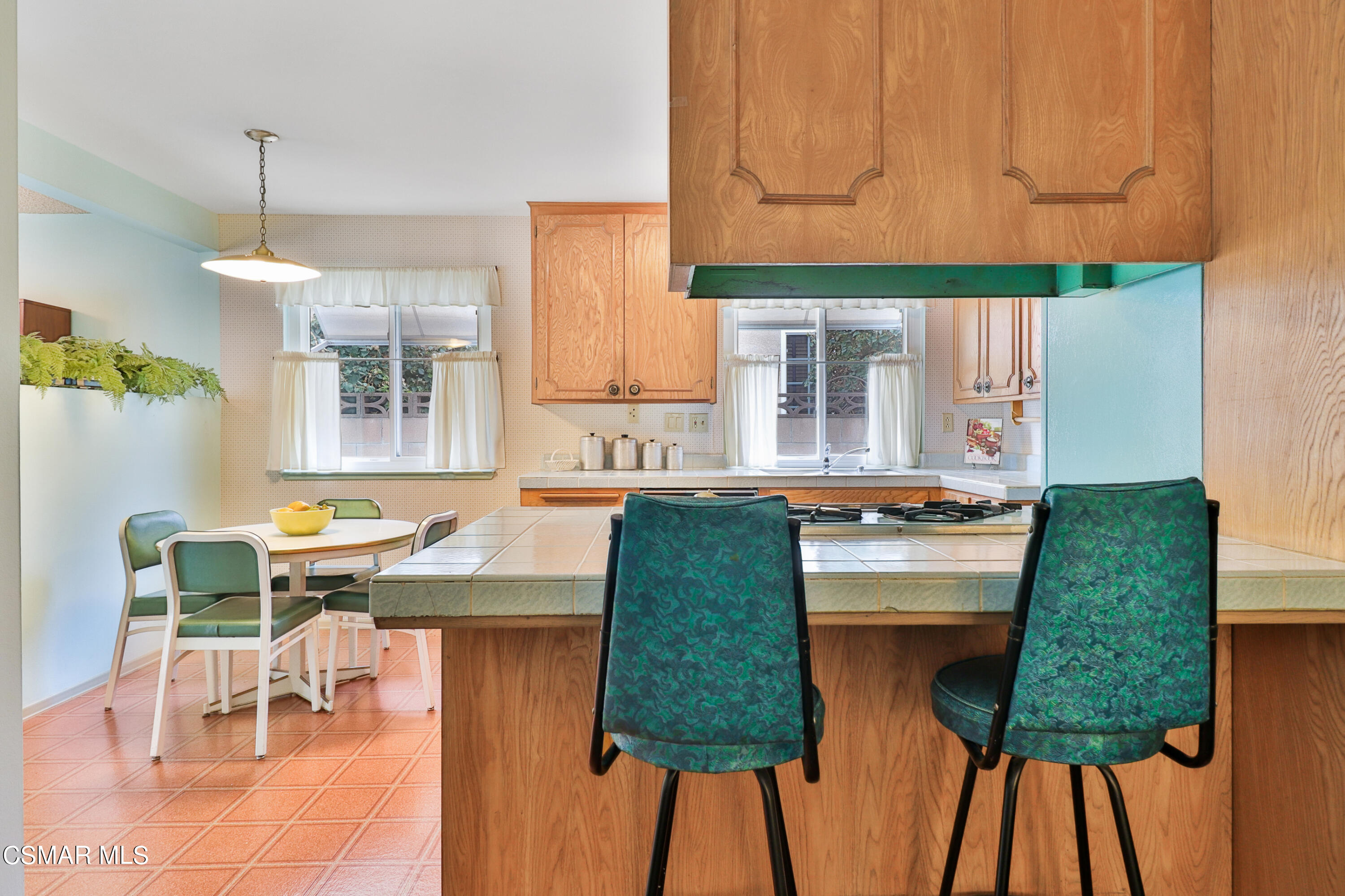 1567 Fitzgerald Road Simi Valley, CA 93065 - Photo 4 of 25 a kitchen with cabinets and chair