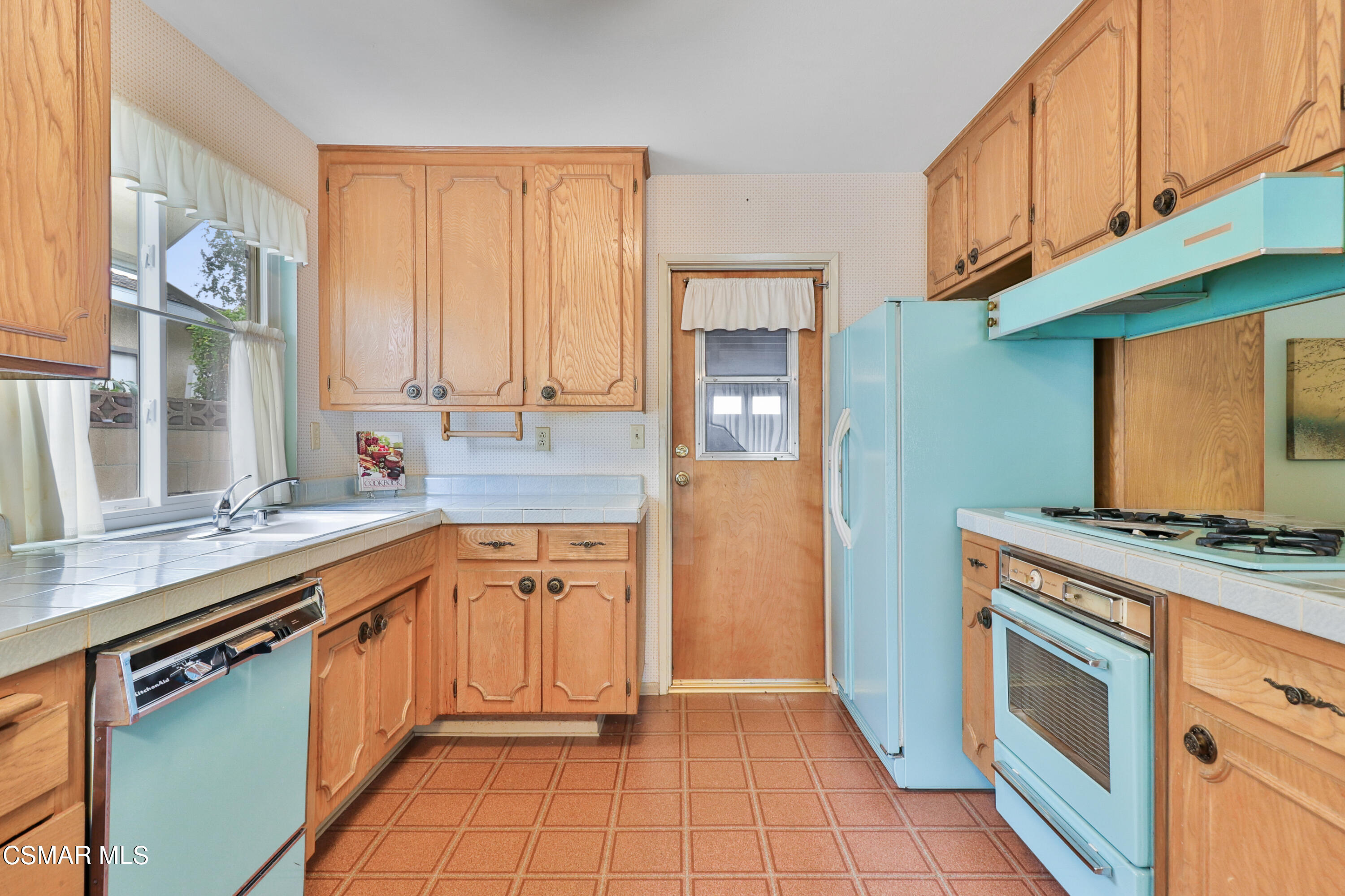 1567 Fitzgerald Road Simi Valley, CA 93065 - Photo 6 of 25 a kitchen with stainless steel appliances granite countertop a stove a sink and a microwave