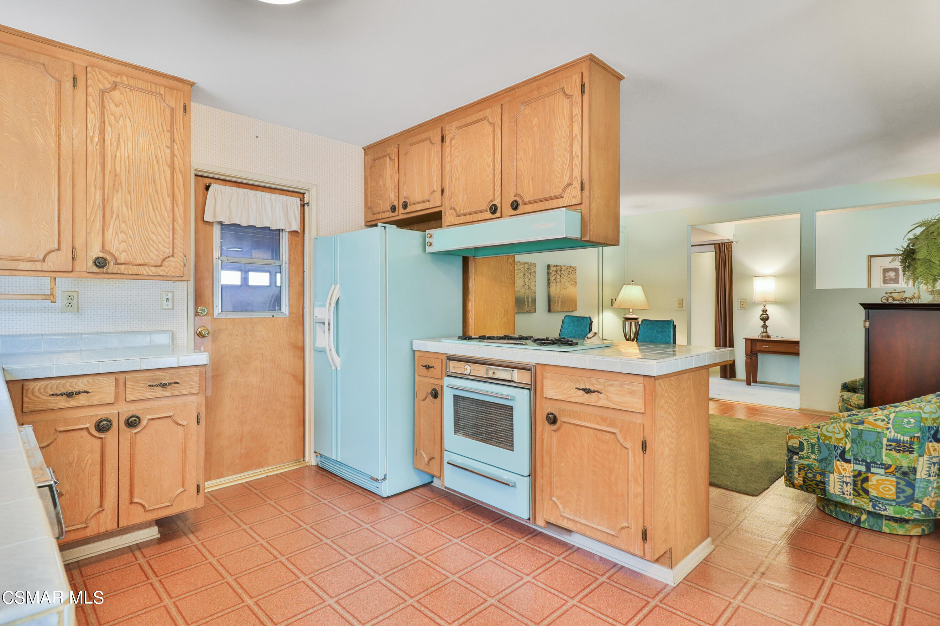 1567 Fitzgerald Road Simi Valley, CA 93065 - Photo 7 of 25 a kitchen with stainless steel appliances granite countertop a refrigerator and a stove top oven