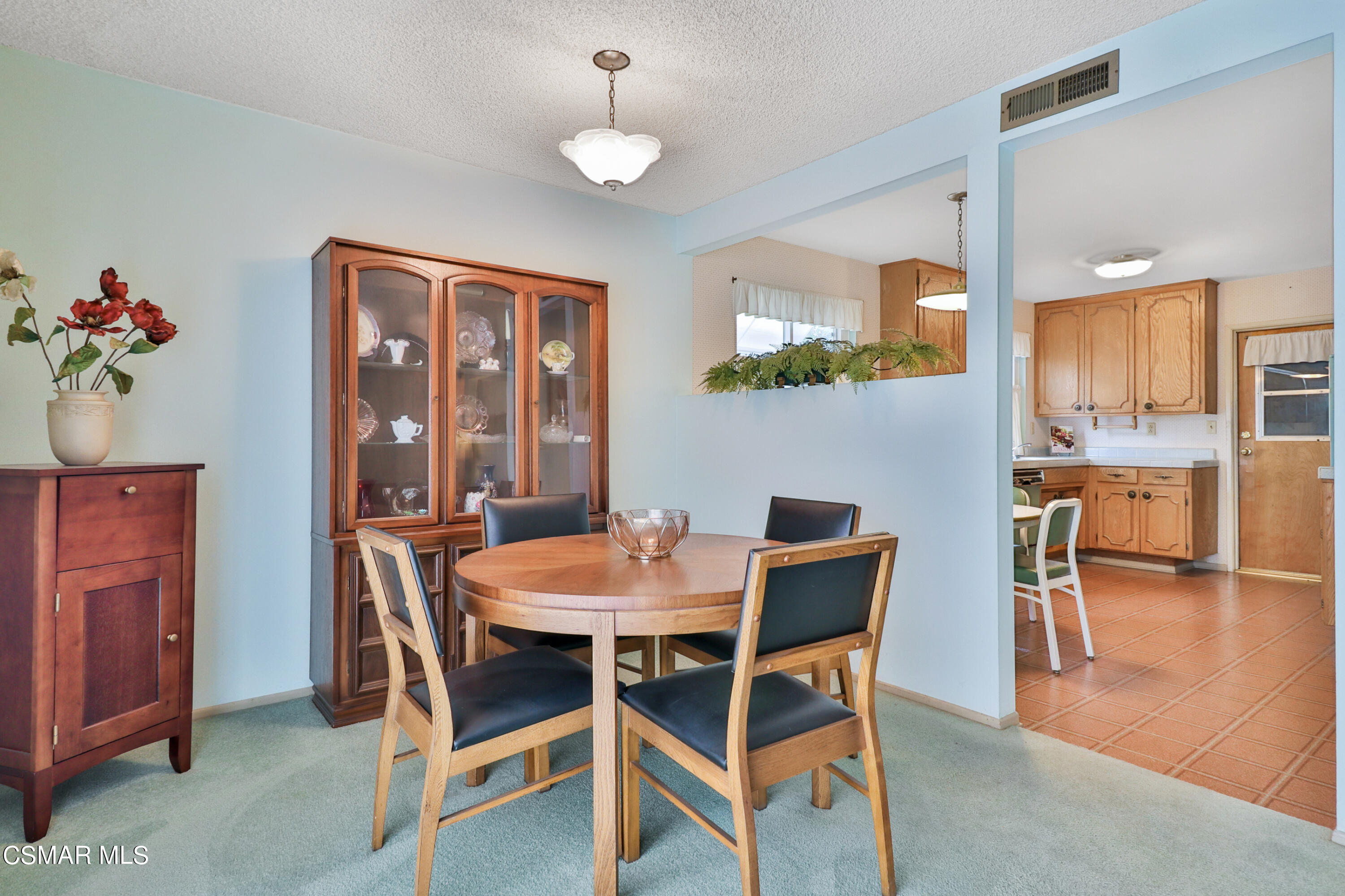 1567 Fitzgerald Road Simi Valley, CA 93065 - Photo 8 of 25 a view of a dining room with furniture and wooden floor