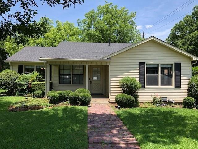 602 West 3rd Street Justin, TX 76247 - Photo 1 of 22 Exterior featuring light-colored siding, a dark shingle roof, and black louvered shutters