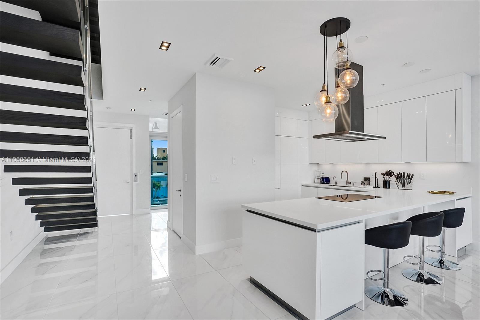 2870 North Ocean Drive Hollywood, FL 33019 - Photo 12 of 57 a kitchen with a sink cabinets and appliances