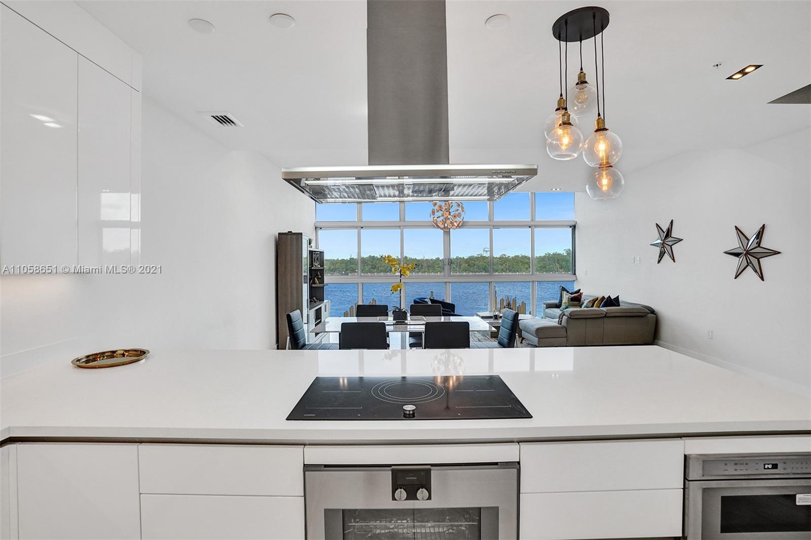 2870 North Ocean Drive Hollywood, FL 33019 - Photo 14 of 57 a kitchen with a sink a stove and cabinets