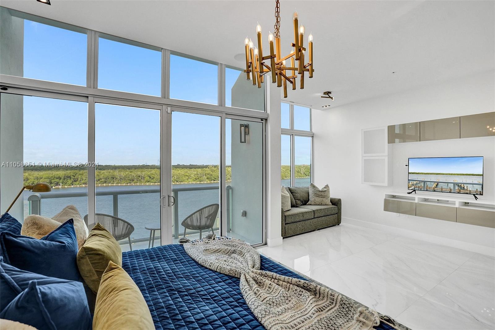 2870 North Ocean Drive Hollywood, FL 33019 - Photo 19 of 57 a living room with furniture or chandelier and a large window