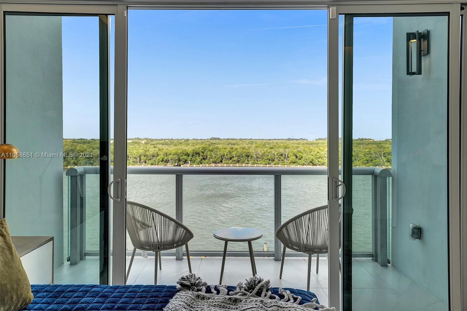 2870 North Ocean Drive Hollywood, FL 33019 - Photo 21 of 57 a view of a balcony with chairs and wooden floor