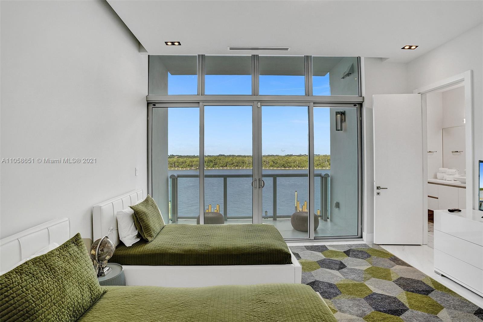 2870 North Ocean Drive Hollywood, FL 33019 - Photo 29 of 57 a bedroom with a bed and a window