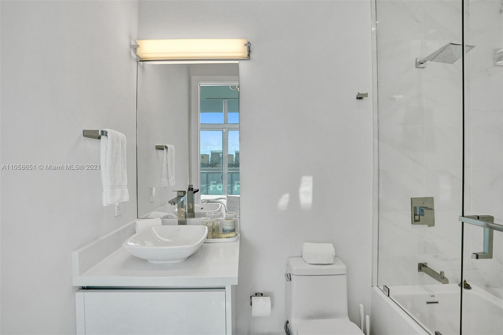 2870 North Ocean Drive Hollywood, FL 33019 - Photo 33 of 57 a bathroom with a sink toilet and shower