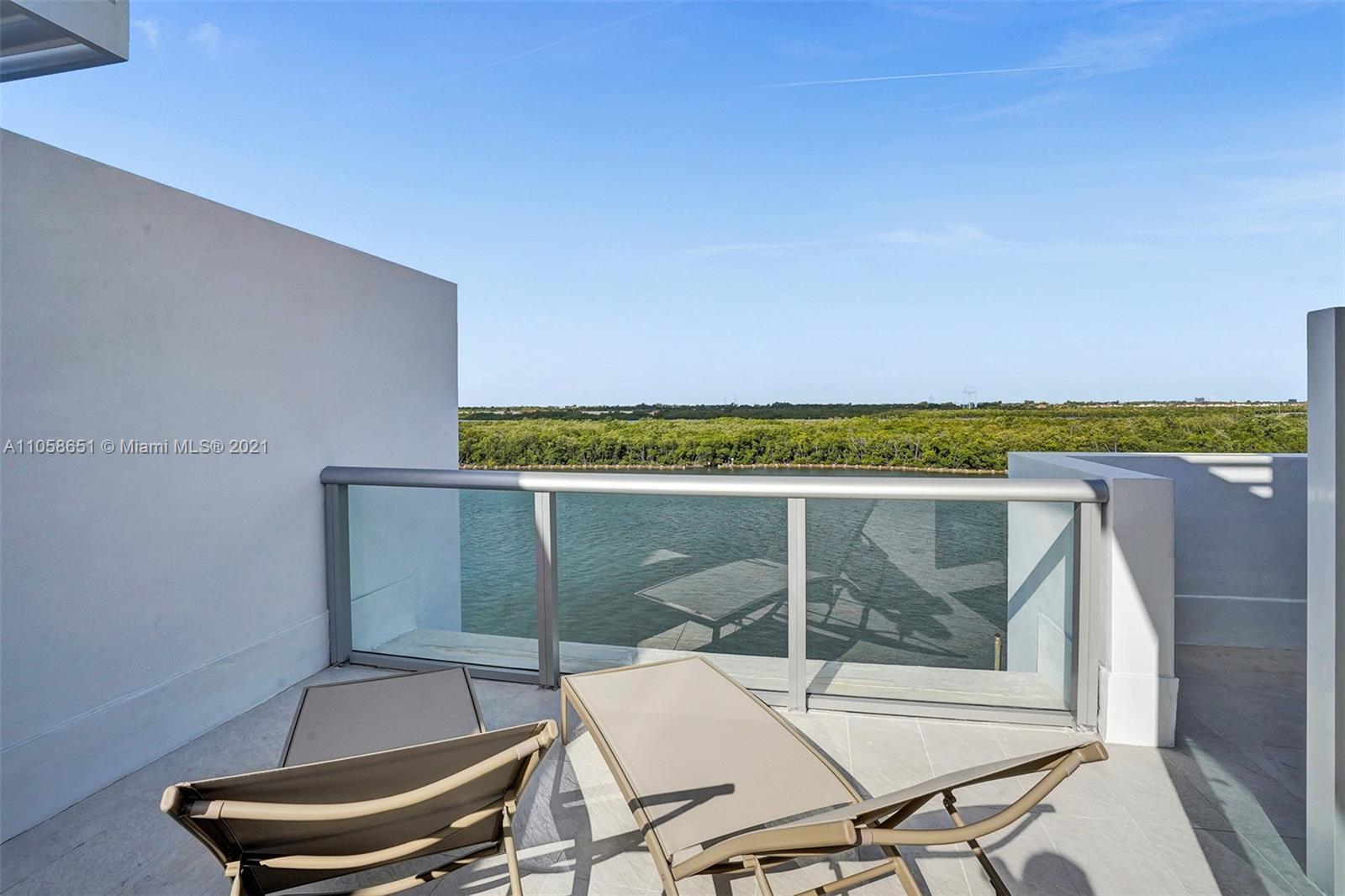 2870 North Ocean Drive Hollywood, FL 33019 - Photo 35 of 57 a balcony with table and chairs