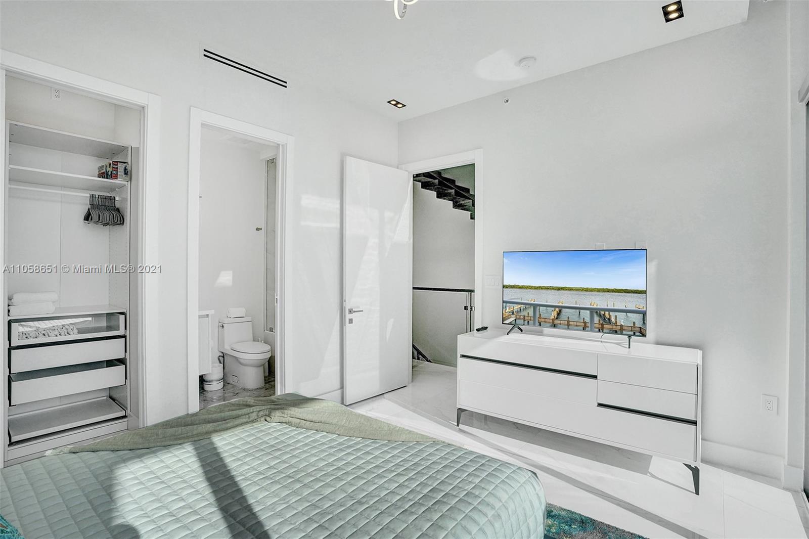 2870 North Ocean Drive Hollywood, FL 33019 - Photo 38 of 57 a bedroom with a bed and a dresser