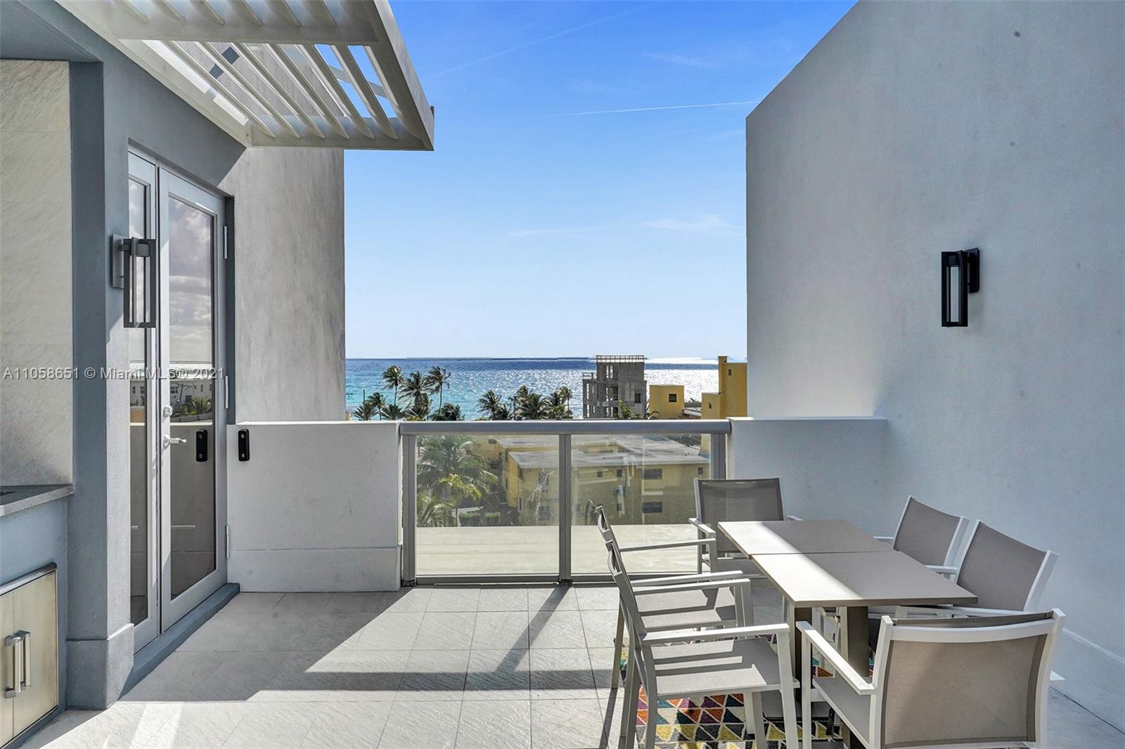 2870 North Ocean Drive Hollywood, FL 33019 - Photo 46 of 57 a view of kitchen with furniture and refrigerator