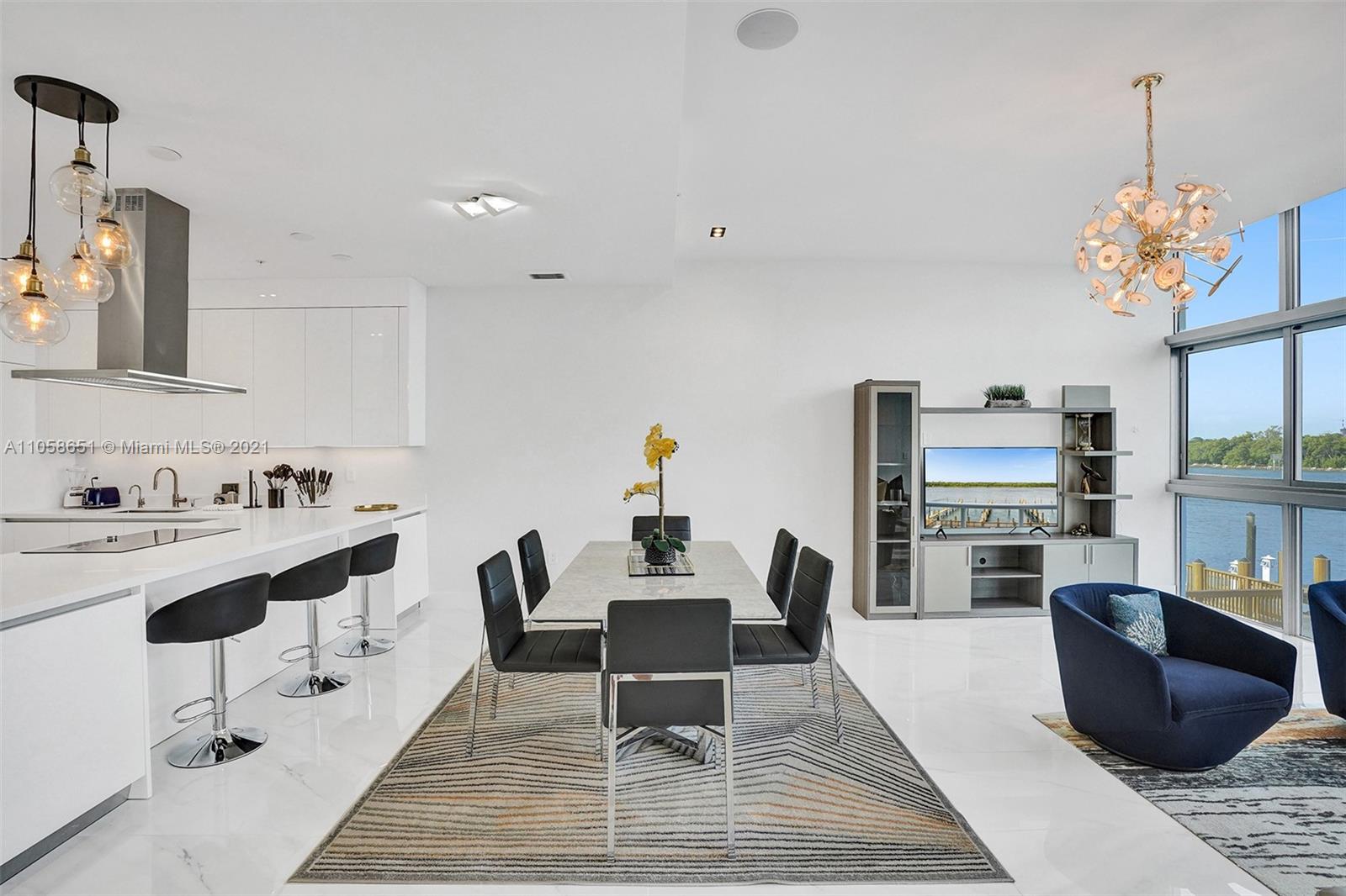 2870 North Ocean Drive Hollywood, FL 33019 - Photo 10 of 57 a living room with furniture and a chandelier