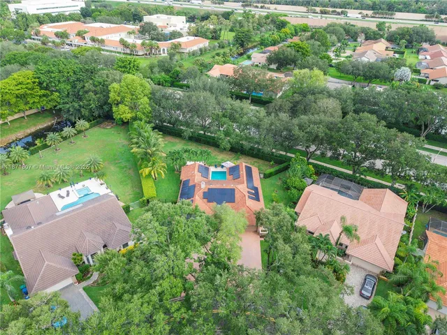 an aerial view of a house with a garden