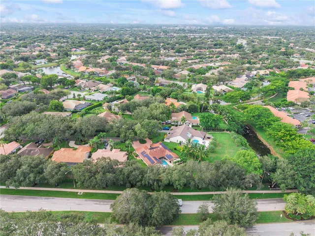 an aerial view of a house with a garden
