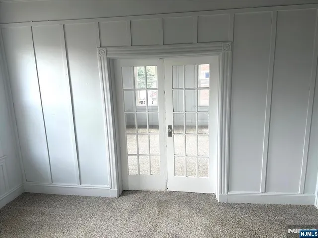 a view of an empty room with a fireplace